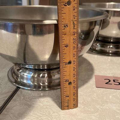 Three stainless still pedestal bowls