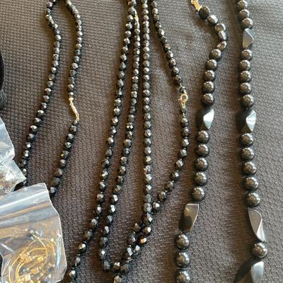 9 black beaded necklaces