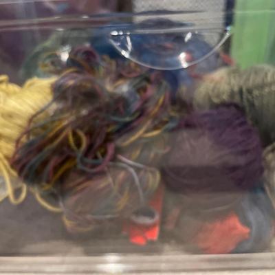 Multiple used rolls of yarn