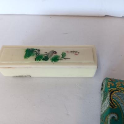 Vintage hand painted Oriental themed sliding lipstick case with small hard sided / cloth covered makeup pouch