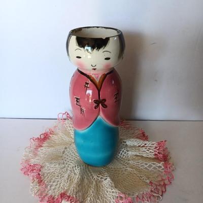 Painted Asian girl vase with vintage pink handcrafted Doiley.