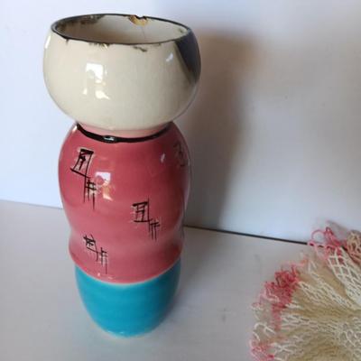 Painted Asian girl vase with vintage pink handcrafted Doiley.