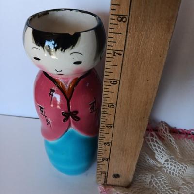 Painted Asian girl vase with vintage pink handcrafted Doiley.