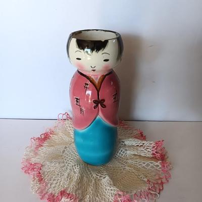 Painted Asian girl vase with vintage pink handcrafted Doiley.