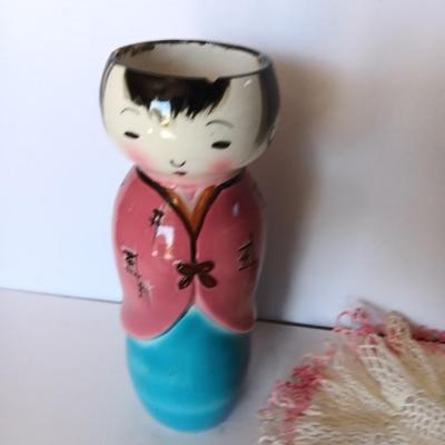 Painted Asian girl vase with vintage pink handcrafted Doiley.