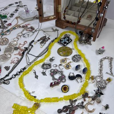 large lot vintage costume jewelry and Wooden Armoire