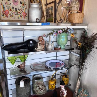 Collectibles on five shelves