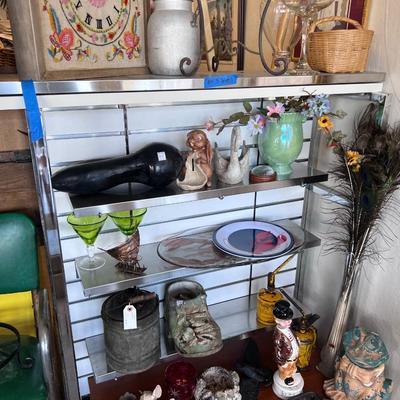 Collectibles on five shelves