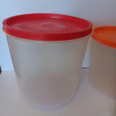 Three plastic lidded food storage containers with Fire King measuring glass