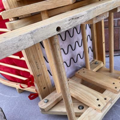 LIGHT WOOD GLIDER ROCKER WITH RED VELVET CUSHIONS
