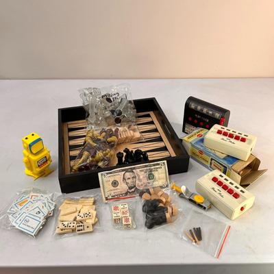 TRAY FULL OF VARIOUS VINTAGE GAME PIECES: DICE, CHESS, POKER MACHINES, ETC.
