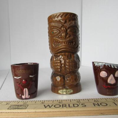 Lot 482:  Tiki Vase and Two Funny Face Shot Glasses
