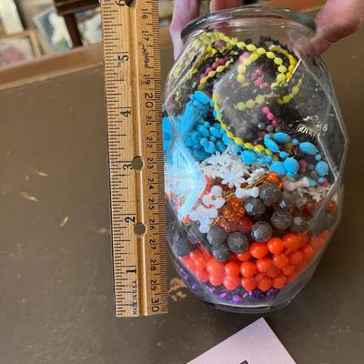 Jar of plastic beads