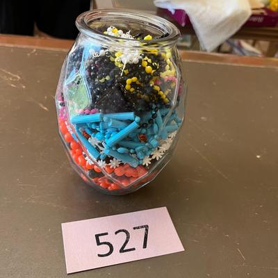 Jar of plastic beads