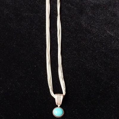 TURQUOISE AND STERLING PENDANT ON A MULTI STRAND STERLING CHAIN