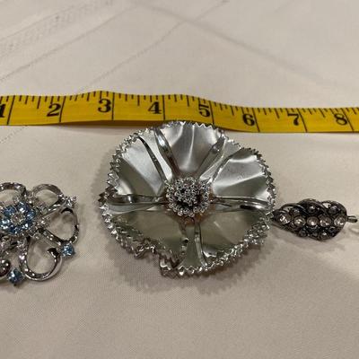Silver brooches and pins