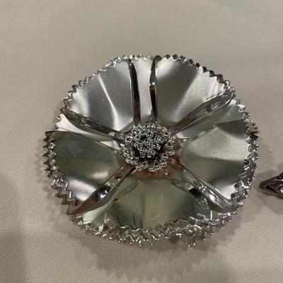 Silver brooches and pins