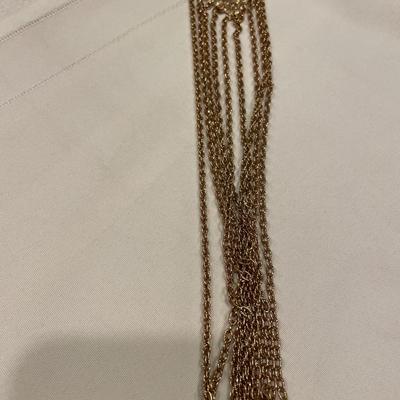 Long gold pin & 4 small brooches