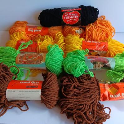 8 skeins of Caron Heavy rug yarn and one black, red heart brand yarn
