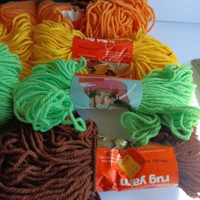 8 skeins of Caron Heavy rug yarn and one black, red heart brand yarn