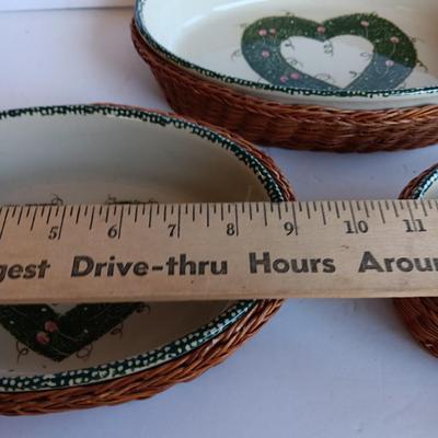 Three heart design nesting bowls each with its own basket.  Heavy ceramic