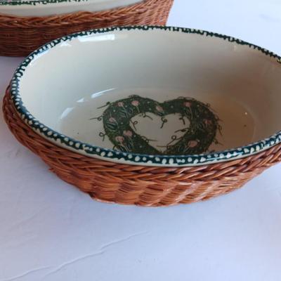 Three heart design nesting bowls each with its own basket.  Heavy ceramic