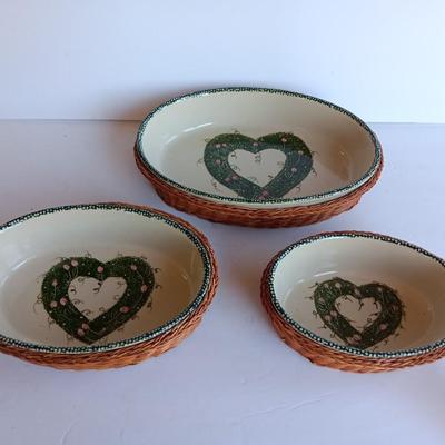 Three heart design nesting bowls each with its own basket.  Heavy ceramic