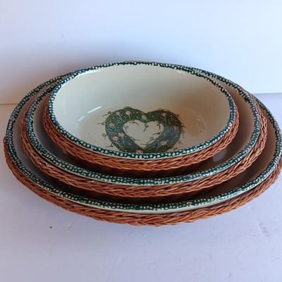 Three heart design nesting bowls each with its own basket.  Heavy ceramic