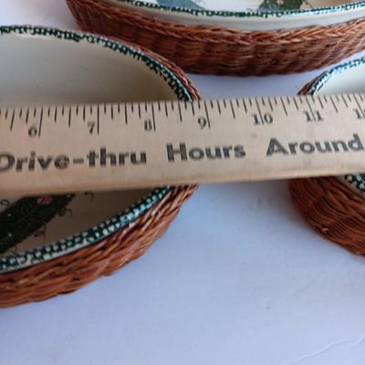Three heart design nesting bowls each with its own basket.  Heavy ceramic