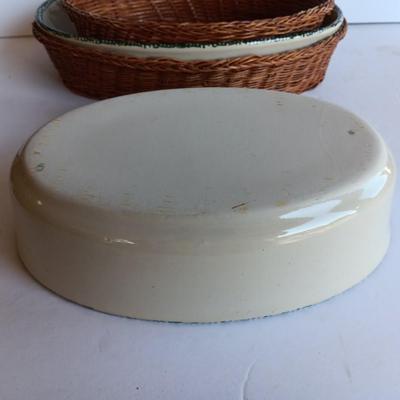Three heart design nesting bowls each with its own basket.  Heavy ceramic