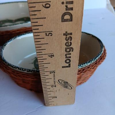 Three heart design nesting bowls each with its own basket.  Heavy ceramic