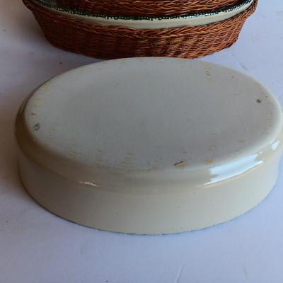 Three heart design nesting bowls each with its own basket.  Heavy ceramic