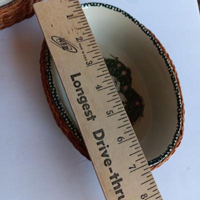 Three heart design nesting bowls each with its own basket.  Heavy ceramic