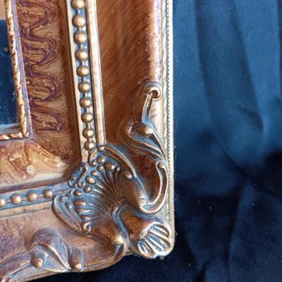 Gold decorative framed wall mirror with wall shelf and Sand dollars