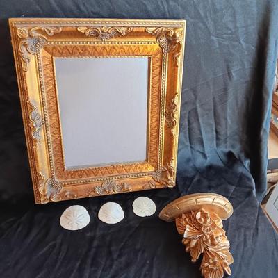 Gold decorative framed wall mirror with wall shelf and Sand dollars