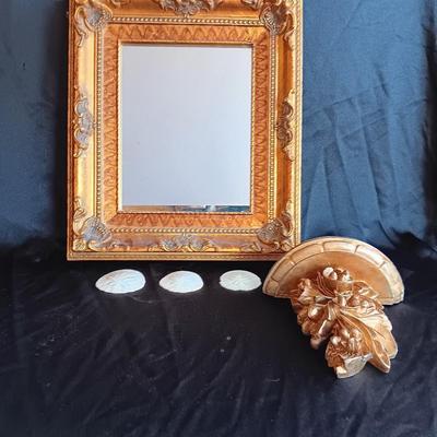 Gold decorative framed wall mirror with wall shelf and Sand dollars