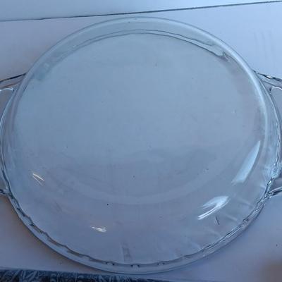 Glass pie dish with three new packages of napkins - Just in time for fresh apple pie!