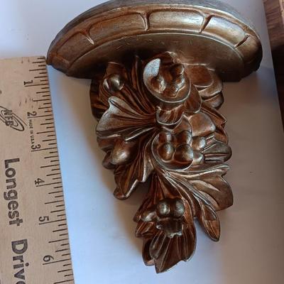 Gold and maroon decorative framed wall mirror with small shelf
