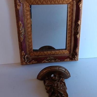 Gold and maroon decorative framed wall mirror with small shelf