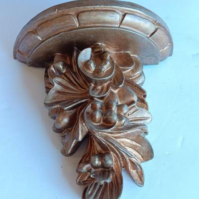 Gold and maroon decorative framed wall mirror with small shelf