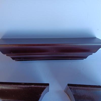 Cherry colored wall shelf with two matching small shelves