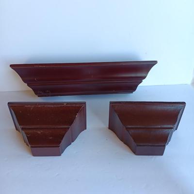 Cherry colored wall shelf with two matching small shelves