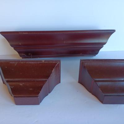 Cherry colored wall shelf with two matching small shelves