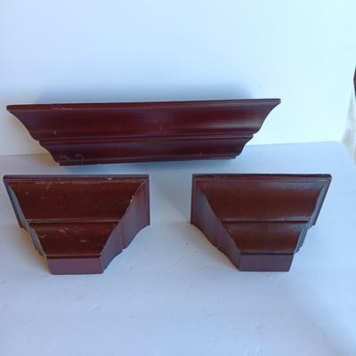Cherry colored wall shelf with two matching small shelves