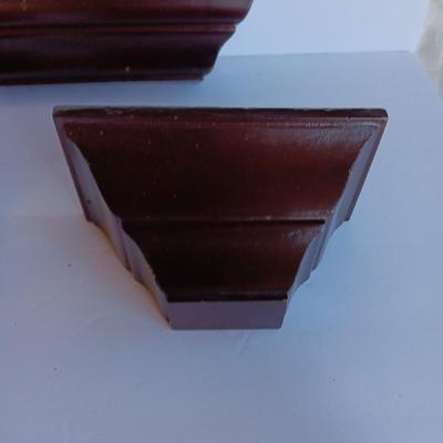 Cherry colored wall shelf with two matching small shelves