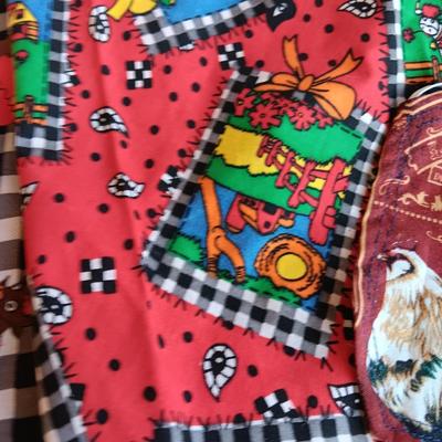 Felt dog coat with several bandanas for a small dog