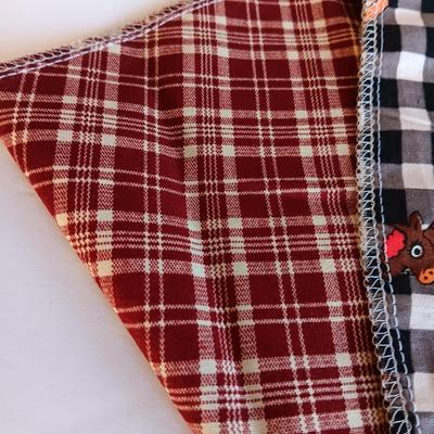 Felt dog coat with several bandanas for a small dog