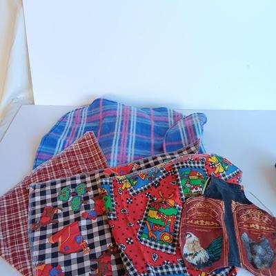 Felt dog coat with several bandanas for a small dog