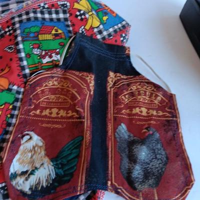 Felt dog coat with several bandanas for a small dog