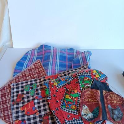 Felt dog coat with several bandanas for a small dog